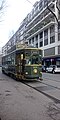 Old little restaurant tram circulating on the rails in the streets of Milano, North Italy