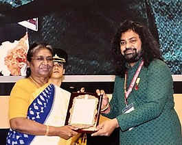 Patri Satish Kumar receiving the Sangeet Natak Akademi Award for 2020 from the President of India, Smt. Draupadi Murmu Patri0.jpg