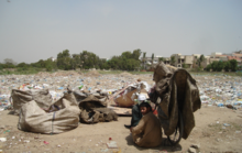 Trash thrown in an empty plot in Karachi, Pakistan. Pollution in karachi.png