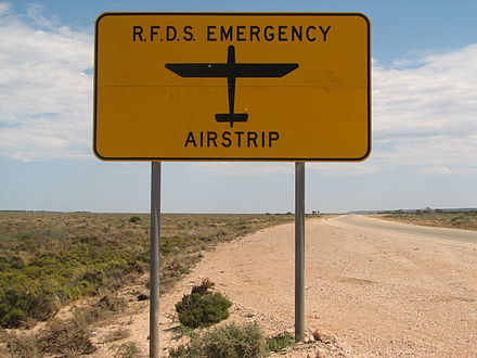 A sign on the Eyre Highway indicating that an RFDS emergency airstrip is ahead. There are three such strips on the highway.