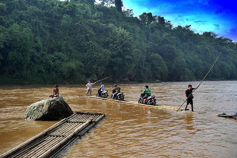 File:Ride a motorbike on a bamboo raft.jpg