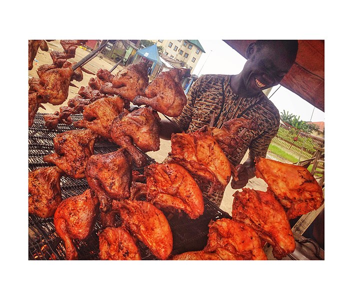 File:Roasted chicken seller with so much happiness.jpg