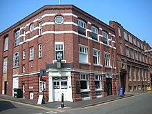 The Royal Birmingham Society of Artists gallery on St Pauls. The wall plaques are by William Bloye. Royal Birmingham Society of Artists.jpg