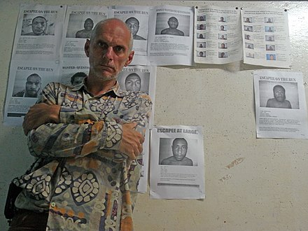 Pinchuk with wanted posters at the Lae police station.