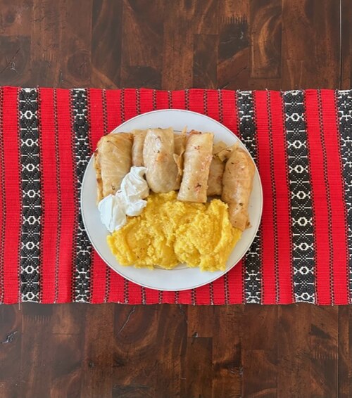 Romanian sarmale with polenta and sour cream