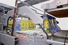 Shrink film wrap being applied on a soft drink packing line Shrink-wrapping machine by OCME S.r.L.jpg