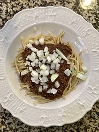 onions placed on chili