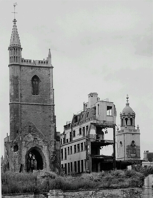 Bomb-damaged buildings and the remains of St Mary le Port church (left) viewed from the south east, following bombing of the area now known as Castle 