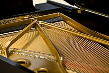 Strings of a grand piano Steinway Grand Piano Iron Plates and Strings.jpg