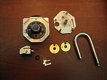 The component parts of a Stoplock combination padlock. Stoplock Dismantled.jpg