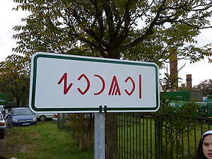 Szolnok city limit sign written in Rovas script (erected in 2010)