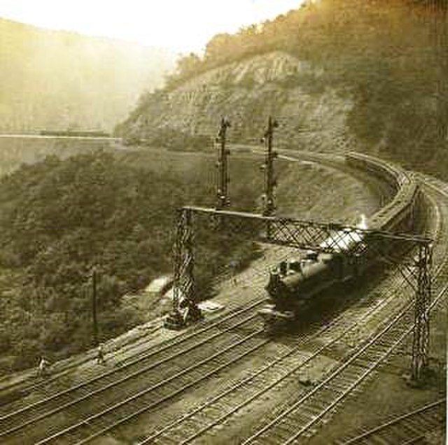 A stereo card of a train on the Horseshoe Curve, c. 1907