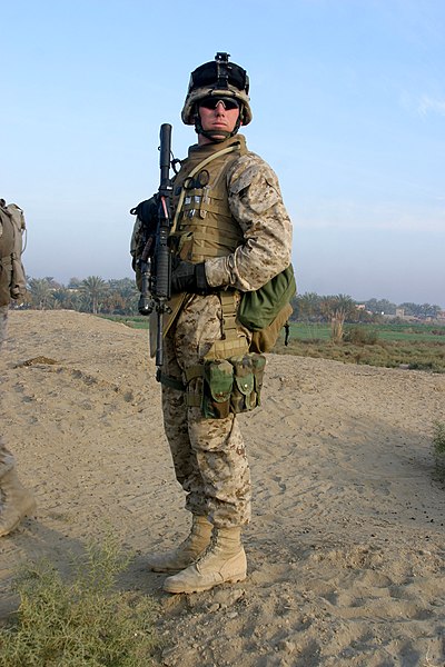 File:US Navy 051206-M-7173M-015 Hospital Corpsman 3rd Class Jesse Munsey, assigned to the 2nd Battalion, 6th Marines, Gulf Company, observes the road up ahead.jpg