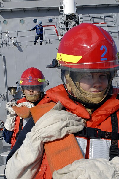 File:US Navy 070903-N-4010S-161 Damage Controlman Fireman Alicia Asbo, and Damage Controlman Fireman Janet Pena man a firehose during a swept mine channel evaluation, part of their ship's first Immediate Superior-in-Charge Uni.jpg