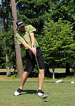 Thumbnail for File:US Navy 080619-N-5642P-075 Lt. j.g Chad Hunsucker, air traffic control center officer aboard the amphibious assault ship USS Kearsarge (LHD 3), swings through a shot during the Surface Line Week golf tournament at Sewell's Poin.jpg