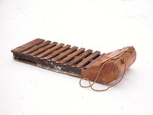 Old-fashioned wooden sled (or Toboggan without runners) Wooden sled.jpg