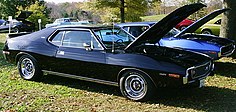 shows a factory original 1973 Javelin AMX finished in black with a 401 "Go Pac"
