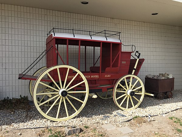 American carriage showcasing thoroughbrace suspension—note the black straps running across the side of the undercarriage