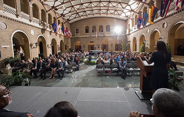 Office of Small and Disadvantaged Business Utilization Deputy Director, Michelle E. Warren, leading an awards ceremony in Washington, D.C.