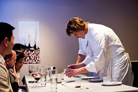 Grant  Achatz shown plating a dish at Alinea, has been called the leading American chef in molecular gastronomy.[28]