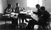 Eric Welsh in a meeting with Samuel Goudsmit, Fred Wardenburg and Rupert Cecil Alsos Members.jpg