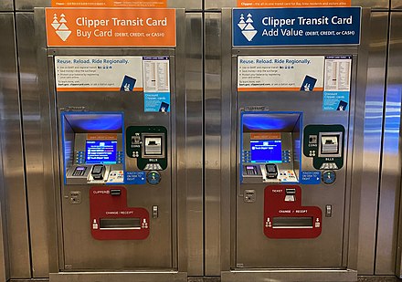 Two BART ticket machines at Embarcadero station in San Francisco. Both have been converted to Clipper card usage only. The machine on the left dispenses new Clipper cards and adds value to existing cards, while the machine on the right only adds value to existing cards.