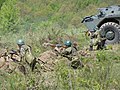 Romanian troops next to a TAB-77 APC during a military exercise of the 191th Infantry Battalion.