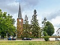 Cruciform church with churchyard and enclosure as well as a memorial for those who fell in the First World War