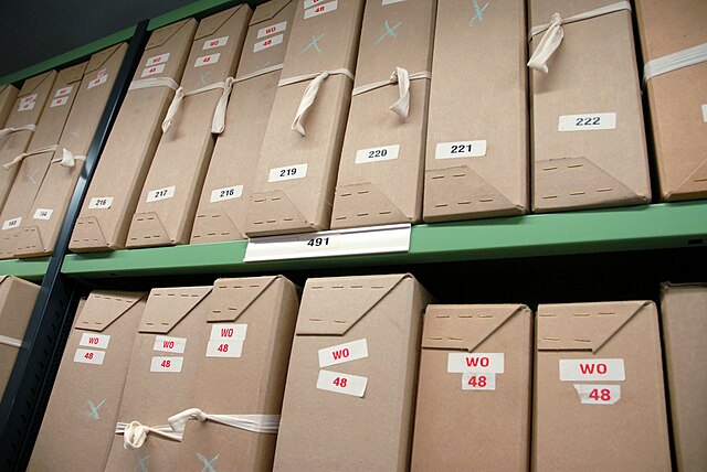 Boxes of documents on repository shelving at the National Archives