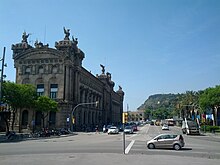 Building and view of distant hill at the foot of Las Ramblas (18603440978).jpg