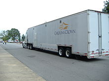 Semi-trailers, such as this one from Carolina Crown, are used variously as equipment trucks and mobile kitchens for DCI corps. DCA corps have no real need for such equipment and usually make use of smaller trucks such as former U-Hauls or other moving van-type vehicles that do not require a special operator license. Carolina Crown Semi.jpg