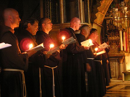 Contemporary Franciscan friars during the procession on the Calvary in the Church of the Holy Sepulchre (2006).