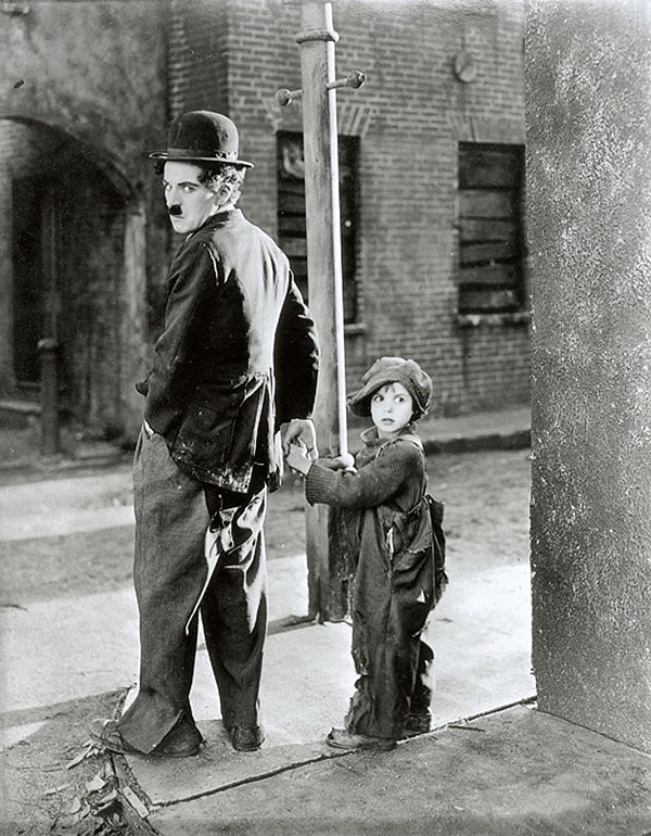 Coogan with Charlie Chaplin in The Kid (1921)