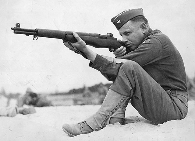 U.S. Army Brigadier General Claudius Miller Easley practicing with an M1 Garand