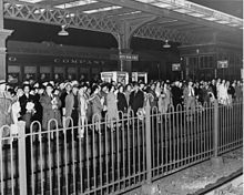 Passengers at North Broad Street in November 1960. Reading Terminal was closed due to fire, forcing passengers to use the Broad Street Line and North Broad Street station. Commuters at North Broad Street station, November 1960.jpg