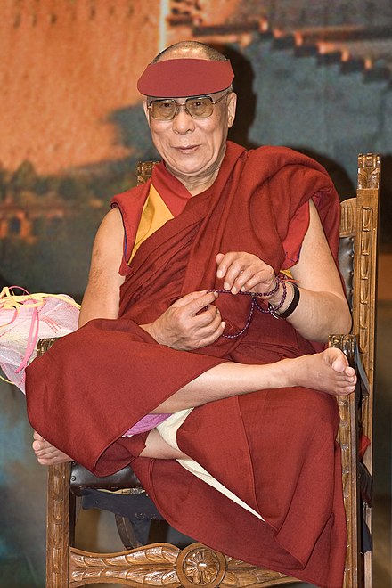 Tenzin Gyatso, the current Dalai Lama, wearing a mala around his wrist