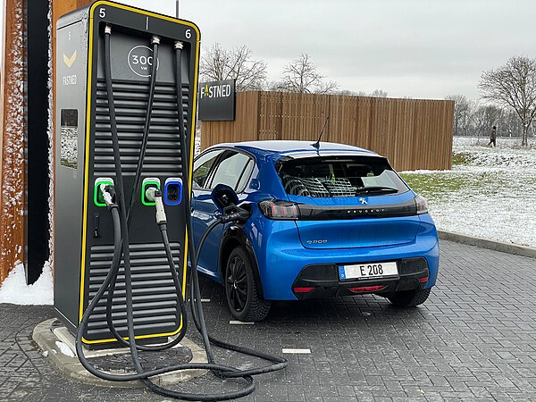 Charging Peugeot e208 at a high power charging station