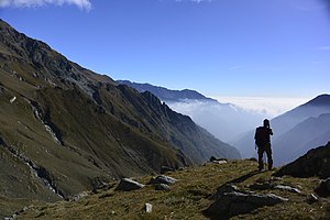 A hiker enjoying the view of the Alps Escursionismo sulle Alpi.jpg
