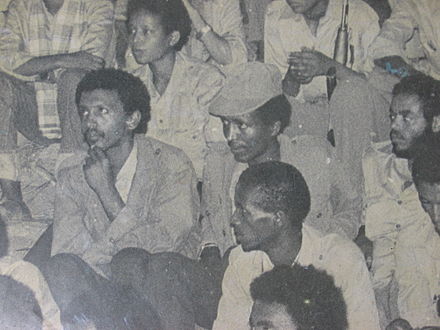 Meles (far right, middle) sitting next to Bereket Simon in a 1970's political meeting