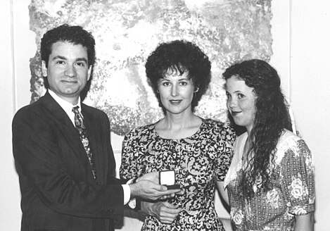 Founder Diamond Mike Watson presents the unmounted diamond to the first diamond winner, Margaret Ketchersid, to give to her mother, Ruth. (Mother's Day, 1991.) First Why Mom Deserves a Diamond contest winner.jpg