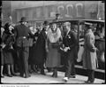 Flora McCrae Eaton and son John David Eaton exiting vehicle at opening of store on College Street.jpg