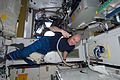 ISS-30 André Kuipers trims his hair in the Tranquility node.jpg