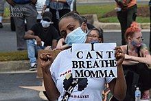 A protester holds a sign saying "I Can't Breathe Momma," at a Black Lives Matter Rally in Dumfries, Virginia. "I Can't Breathe Mama," was one of the last words said by George Floyd while he was being murdered. I Can't Breathe Mama.jpg