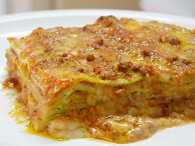 Green lasagna (made with spinach in the dough), with ragù, Parmesan and bechamel, typical of Bolognese cuisine