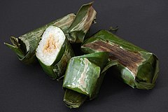 Lemper, glutinous rice filled with chicken wrapped in banana leaves