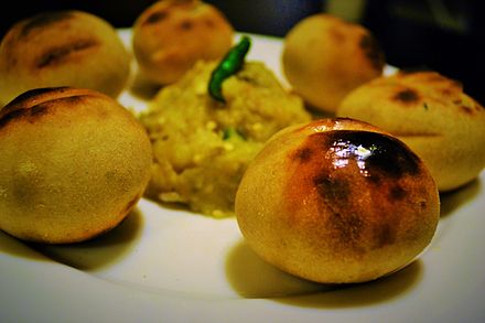 Litti chokha dipped in ghee