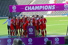 Bronze (second left; number 6) with Liverpool winning the 2013 FA WSL Championship Liverpool L.F.C. IMG 6454.jpg