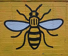 Illustration of a bee spray-painted onto a wall