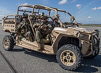 Marines conduct a simulated raid in an all-terrain vehicles at Fort Greely on 22 May 2019 (cropped).jpg