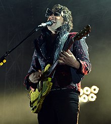 Chedid performing in 2014